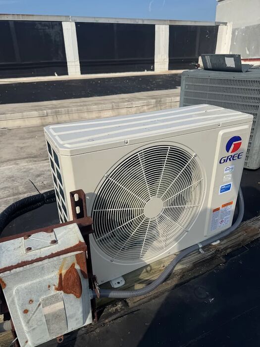 Ductless outdoor unit replaced on a flat roof