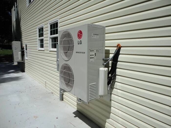 LG inverter mini-split installed on a residential side wall