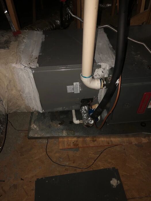 Air handler and flue work inside a crawl space
